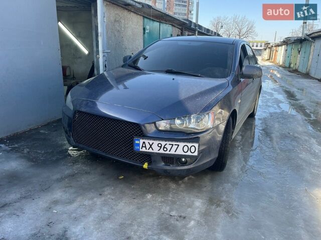 Синий Мицубиси Лансер, объемом двигателя 2 л и пробегом 230 тыс. км за 6600 $, фото 1 на Automoto.ua