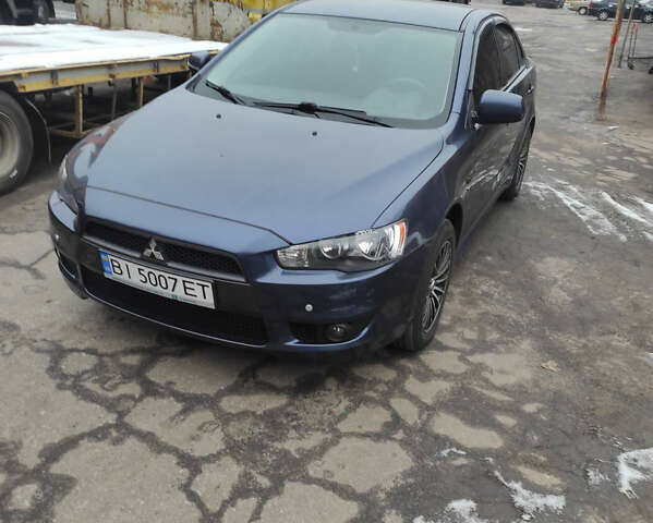 Синий Мицубиси Лансер, объемом двигателя 2 л и пробегом 72 тыс. км за 10400 $, фото 1 на Automoto.ua