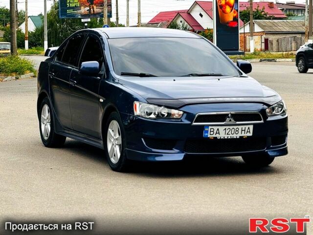 Синий Мицубиси Лансер, объемом двигателя 2 л и пробегом 175 тыс. км за 6800 $, фото 1 на Automoto.ua