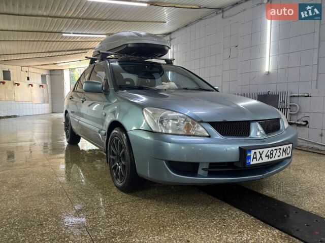 Синій Міцубісі Lancer, об'ємом двигуна 1.58 л та пробігом 342 тис. км за 2500 $, фото 1 на Automoto.ua