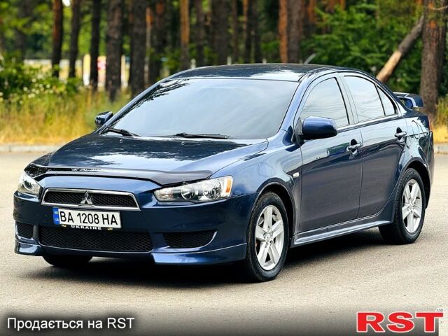 Синий Мицубиси Лансер, объемом двигателя 2 л и пробегом 170 тыс. км за 7500 $, фото 1 на Automoto.ua