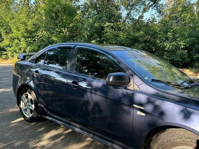 Синій Міцубісі Lancer, об'ємом двигуна 2 л та пробігом 313 тис. км за 5500 $, фото 1 на Automoto.ua