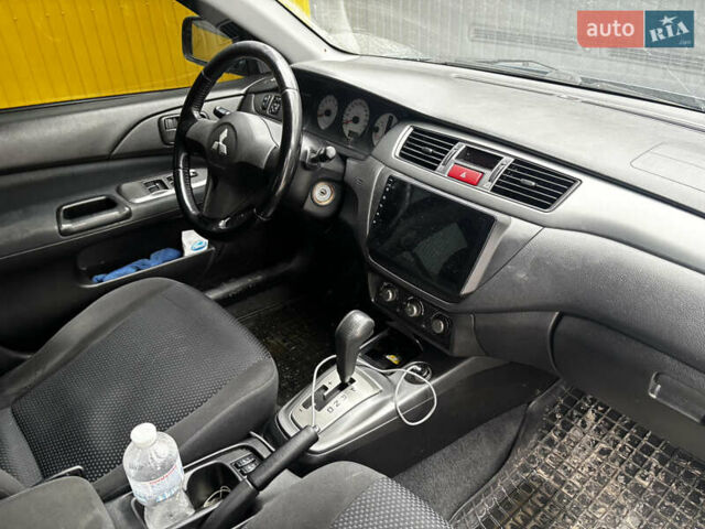 Синий Мицубиси Лансер, объемом двигателя 1.6 л и пробегом 360 тыс. км за 5000 $, фото 1 на Automoto.ua