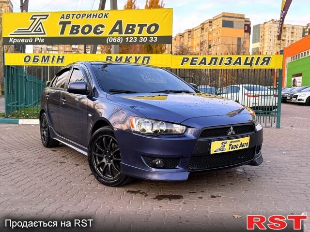 Синий Мицубиси Лансер, объемом двигателя 2 л и пробегом 189 тыс. км за 7350 $, фото 1 на Automoto.ua