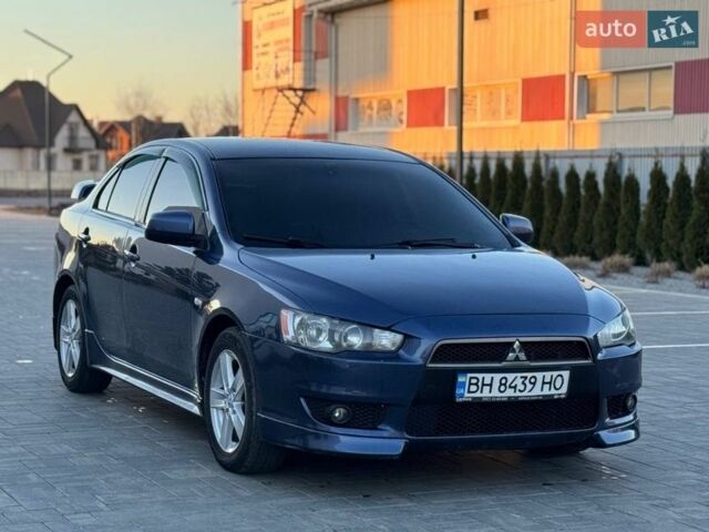Синий Мицубиси Лансер, объемом двигателя 2 л и пробегом 230 тыс. км за 6400 $, фото 1 на Automoto.ua