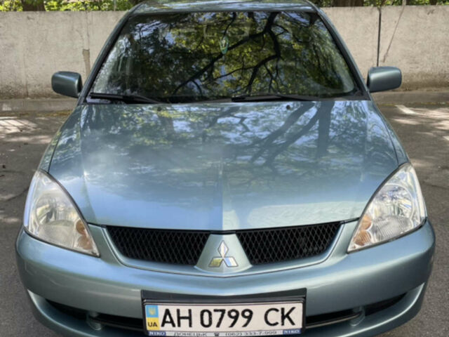 Синій Міцубісі Lancer, об'ємом двигуна 1.58 л та пробігом 210 тис. км за 5000 $, фото 1 на Automoto.ua