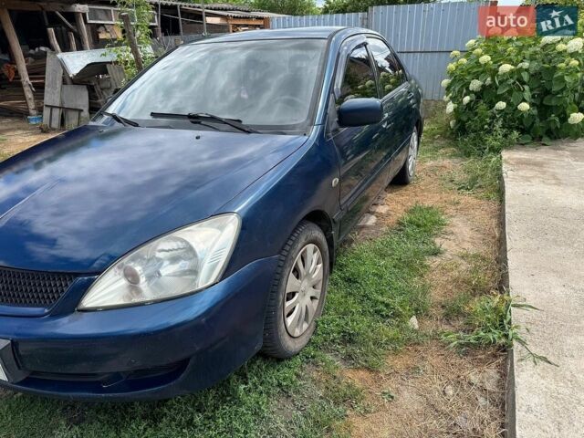 Синій Міцубісі Lancer, об'ємом двигуна 1.58 л та пробігом 240 тис. км за 3000 $, фото 1 на Automoto.ua