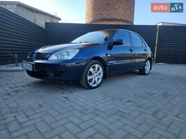 Синий Мицубиси Лансер, объемом двигателя 1.59 л и пробегом 307 тыс. км за 2500 $, фото 1 на Automoto.ua