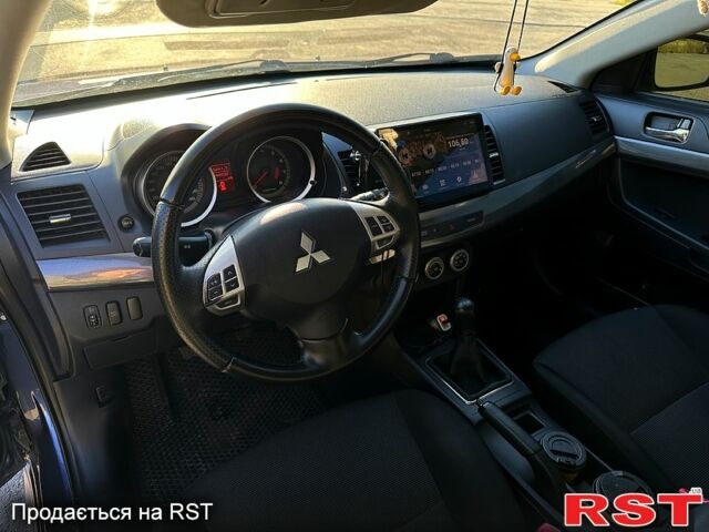 Синий Мицубиси Лансер, объемом двигателя 2 л и пробегом 25000 тыс. км за 6000 $, фото 1 на Automoto.ua