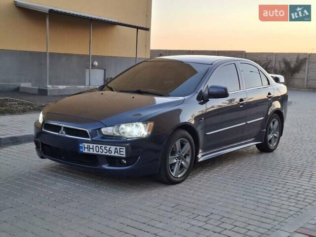 Синій Міцубісі Lancer, об'ємом двигуна 2 л та пробігом 234 тис. км за 6700 $, фото 1 на Automoto.ua