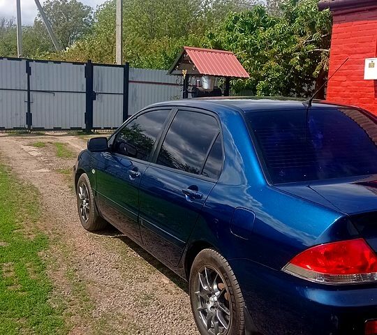 Синій Міцубісі Lancer, об'ємом двигуна 1.6 л та пробігом 300 тис. км за 4200 $, фото 1 на Automoto.ua