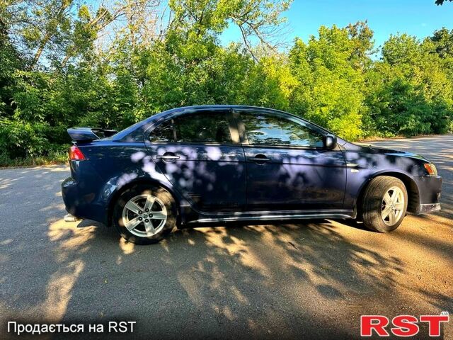 Синій Міцубісі Lancer, об'ємом двигуна 2 л та пробігом 314 тис. км за 5400 $, фото 1 на Automoto.ua