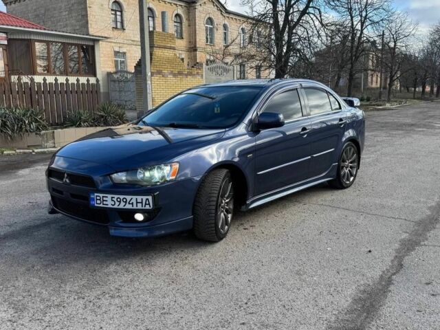 Синий Мицубиси Лансер, объемом двигателя 2 л и пробегом 200 тыс. км за 6500 $, фото 1 на Automoto.ua