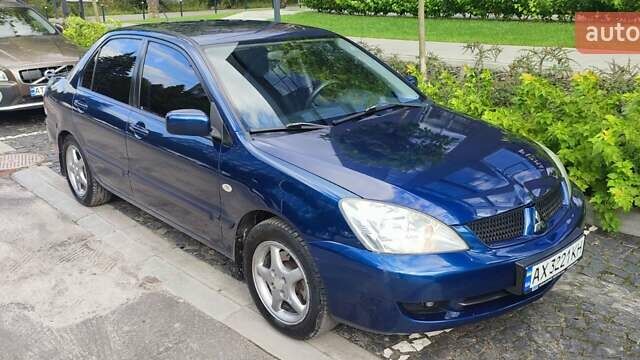 Синій Міцубісі Lancer, об'ємом двигуна 1.6 л та пробігом 198 тис. км за 4800 $, фото 1 на Automoto.ua