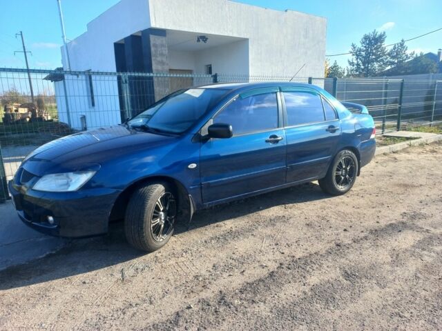 Синій Міцубісі Lancer, об'ємом двигуна 1 л та пробігом 111 тис. км за 3100 $, фото 1 на Automoto.ua
