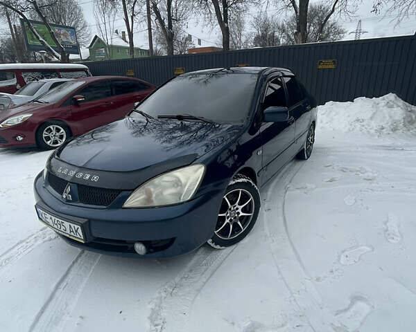 Синий Мицубиси Лансер, объемом двигателя 1.58 л и пробегом 319 тыс. км за 3700 $, фото 1 на Automoto.ua