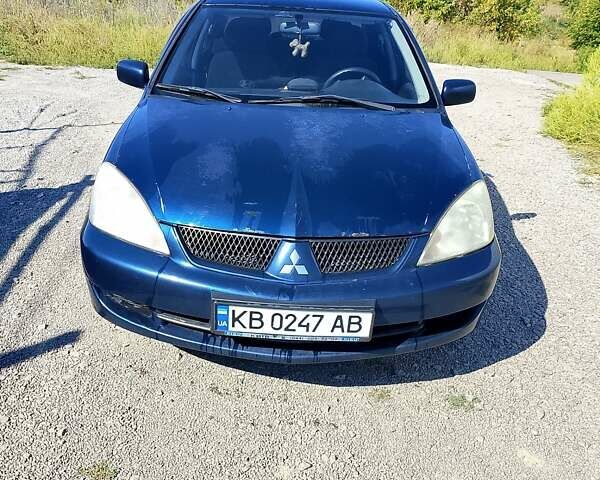 Синій Міцубісі Lancer, об'ємом двигуна 1.58 л та пробігом 317 тис. км за 3600 $, фото 1 на Automoto.ua