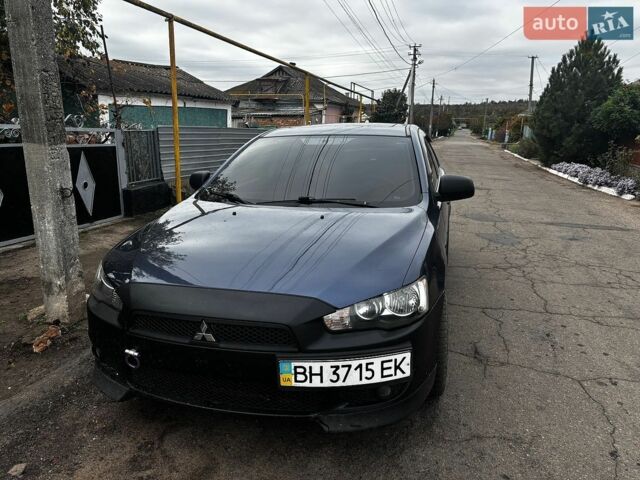 Синій Міцубісі Lancer, об'ємом двигуна 2 л та пробігом 250 тис. км за 5399 $, фото 1 на Automoto.ua