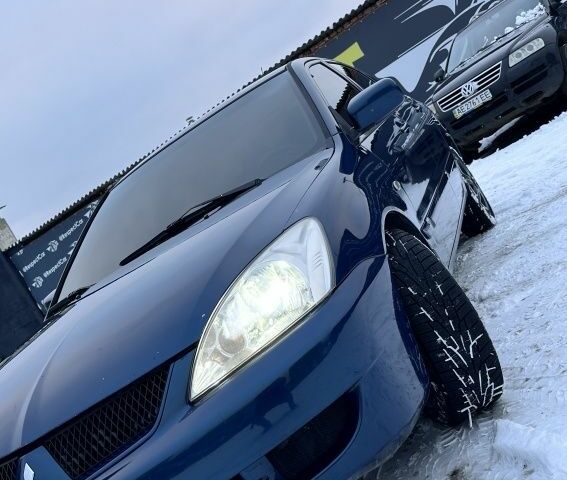 Синий Мицубиси Лансер, объемом двигателя 1.6 л и пробегом 233 тыс. км за 4150 $, фото 1 на Automoto.ua