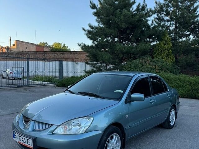 Синій Міцубісі Lancer, об'ємом двигуна 1.58 л та пробігом 230 тис. км за 4100 $, фото 1 на Automoto.ua