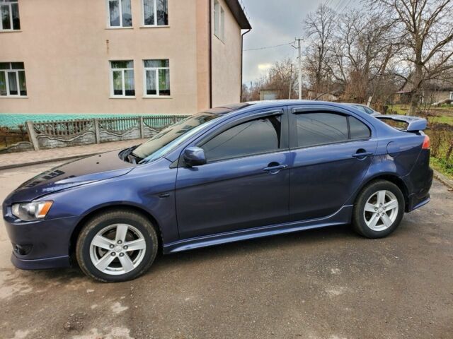 Синий Мицубиси Лансер, объемом двигателя 2 л и пробегом 195 тыс. км за 7900 $, фото 1 на Automoto.ua