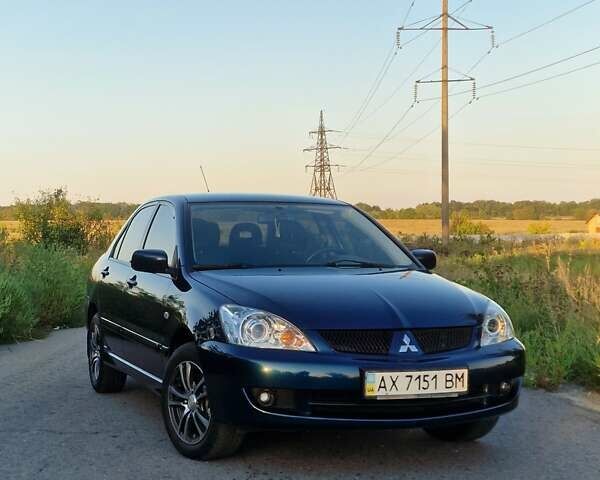 Синий Мицубиси Лансер, объемом двигателя 1.6 л и пробегом 197 тыс. км за 6500 $, фото 1 на Automoto.ua