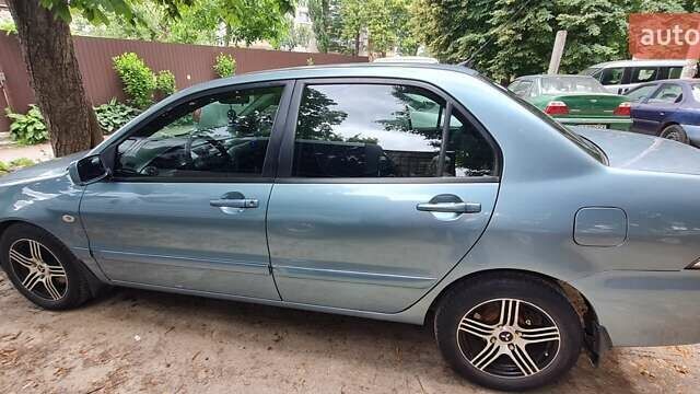 Синій Міцубісі Lancer, об'ємом двигуна 1.58 л та пробігом 215 тис. км за 5200 $, фото 1 на Automoto.ua
