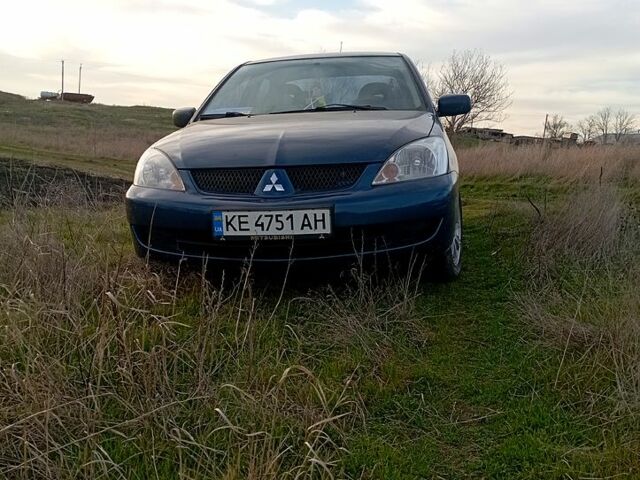 Синий Мицубиси Лансер, объемом двигателя 1.6 л и пробегом 150 тыс. км за 4999 $, фото 1 на Automoto.ua