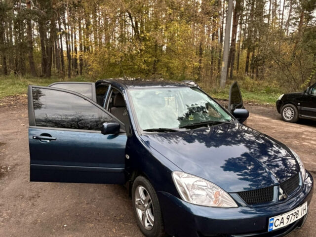 Синій Міцубісі Lancer, об'ємом двигуна 1.6 л та пробігом 155 тис. км за 5200 $, фото 1 на Automoto.ua