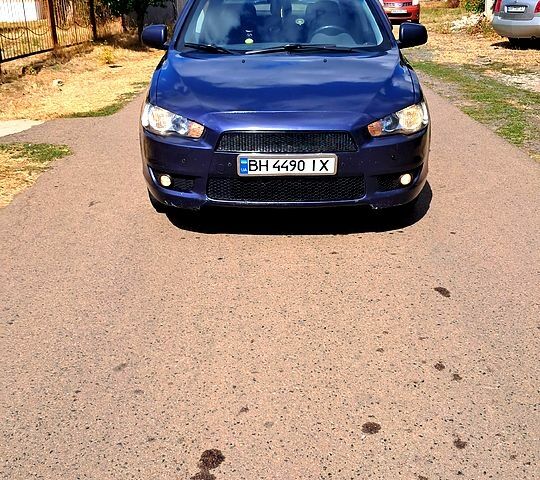 Синій Міцубісі Lancer, об'ємом двигуна 2 л та пробігом 242 тис. км за 5300 $, фото 1 на Automoto.ua