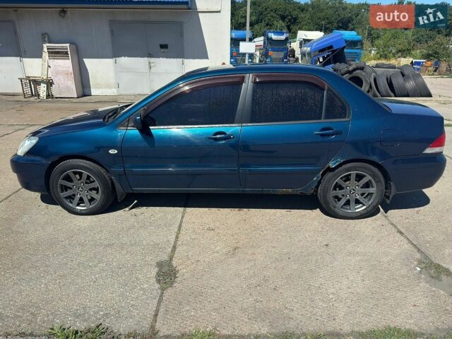 Синій Міцубісі Lancer, об'ємом двигуна 1.6 л та пробігом 302 тис. км за 2150 $, фото 1 на Automoto.ua
