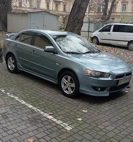 Синий Мицубиси Лансер, объемом двигателя 2 л и пробегом 300 тыс. км за 6900 $, фото 1 на Automoto.ua