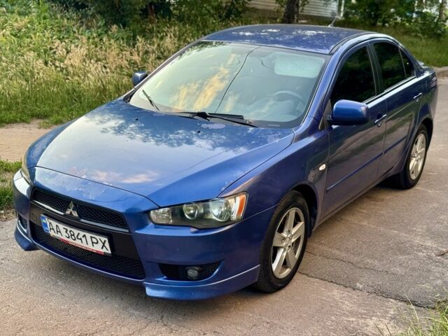 Синій Міцубісі Lancer, об'ємом двигуна 2 л та пробігом 185 тис. км за 4650 $, фото 1 на Automoto.ua