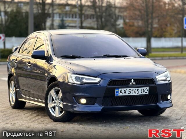 Синій Міцубісі Lancer, об'ємом двигуна 2 л та пробігом 218 тис. км за 7450 $, фото 1 на Automoto.ua