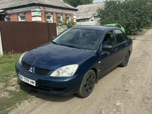 Синій Міцубісі Lancer, об'ємом двигуна 1.6 л та пробігом 197 тис. км за 2900 $, фото 1 на Automoto.ua