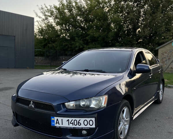 Синий Мицубиси Лансер, объемом двигателя 2 л и пробегом 280 тыс. км за 6900 $, фото 1 на Automoto.ua