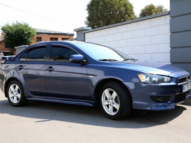 Синій Міцубісі Lancer, об'ємом двигуна 2 л та пробігом 243 тис. км за 6601 $, фото 1 на Automoto.ua