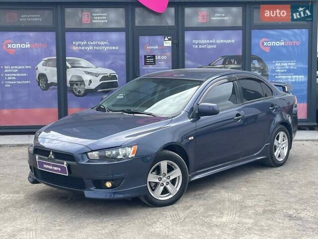 Синий Мицубиси Лансер, объемом двигателя 2 л и пробегом 142 тыс. км за 8000 $, фото 1 на Automoto.ua