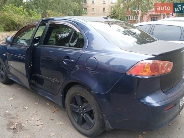Синій Міцубісі Lancer, об'ємом двигуна 2 л та пробігом 265 тис. км за 5700 $, фото 1 на Automoto.ua