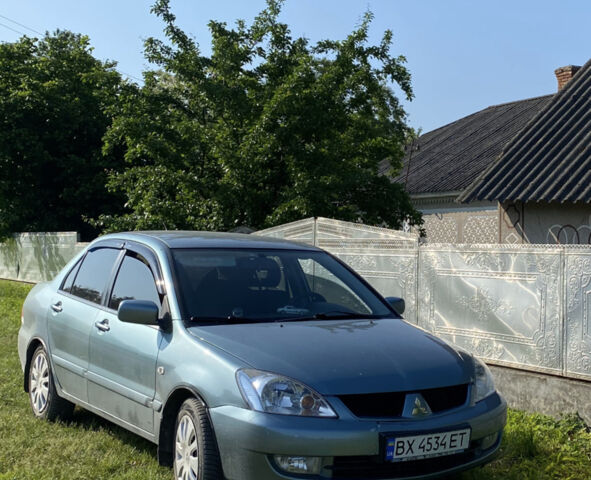 Синій Міцубісі Lancer, об'ємом двигуна 1.58 л та пробігом 200 тис. км за 4900 $, фото 1 на Automoto.ua