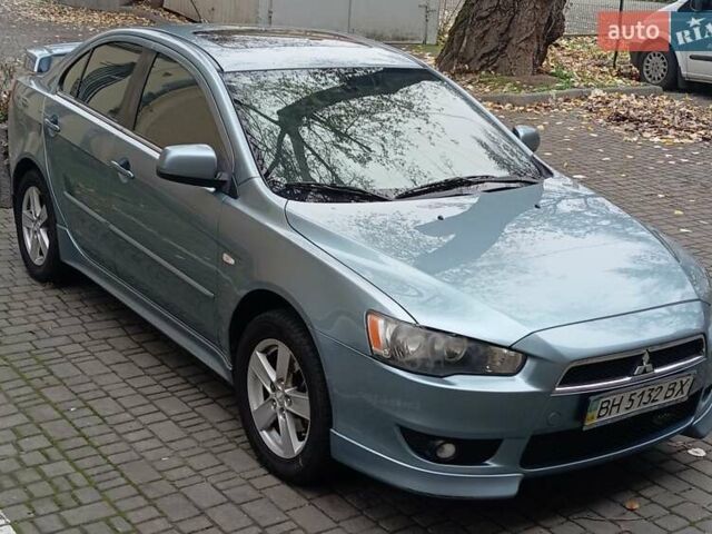 Синий Мицубиси Лансер, объемом двигателя 2 л и пробегом 300 тыс. км за 5600 $, фото 1 на Automoto.ua