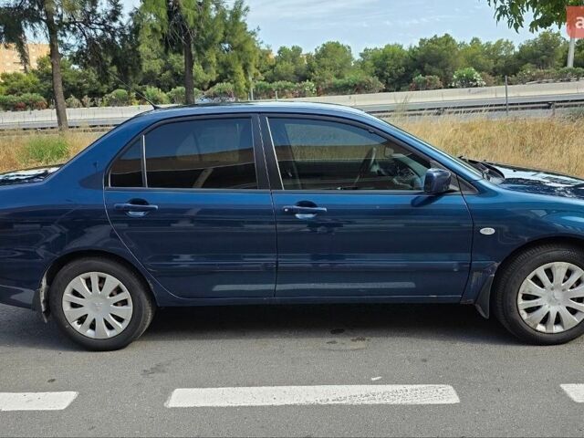 Синій Міцубісі Lancer, об'ємом двигуна 1.6 л та пробігом 166 тис. км за 3900 $, фото 1 на Automoto.ua