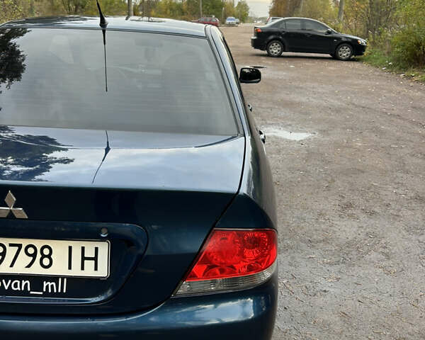 Синий Мицубиси Лансер, объемом двигателя 1.6 л и пробегом 150 тыс. км за 5700 $, фото 1 на Automoto.ua