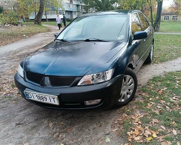 Синий Мицубиси Лансер, объемом двигателя 1.58 л и пробегом 250 тыс. км за 4200 $, фото 1 на Automoto.ua