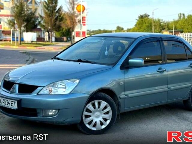 Синий Мицубиси Лансер, объемом двигателя 1.6 л и пробегом 200 тыс. км за 5000 $, фото 1 на Automoto.ua