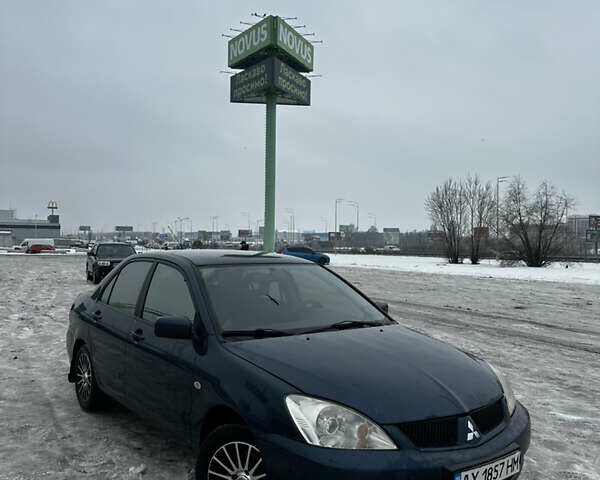 Синий Мицубиси Лансер, объемом двигателя 1.58 л и пробегом 195 тыс. км за 4200 $, фото 1 на Automoto.ua