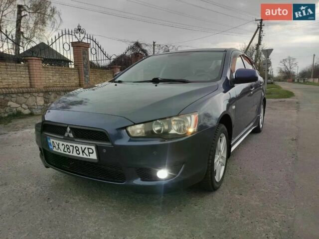 Синій Міцубісі Lancer, об'ємом двигуна 2 л та пробігом 205 тис. км за 6799 $, фото 1 на Automoto.ua