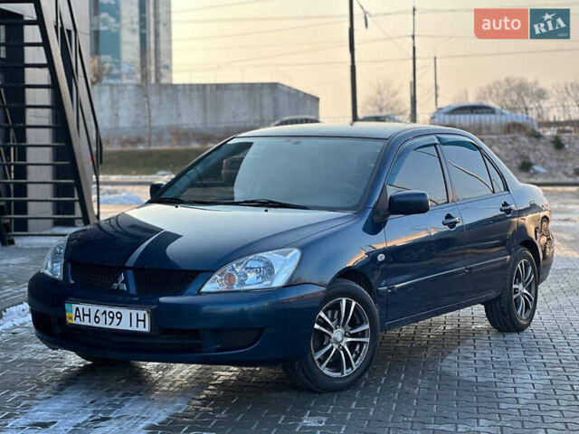 Синій Міцубісі Lancer, об'ємом двигуна 1.6 л та пробігом 250 тис. км за 5499 $, фото 1 на Automoto.ua