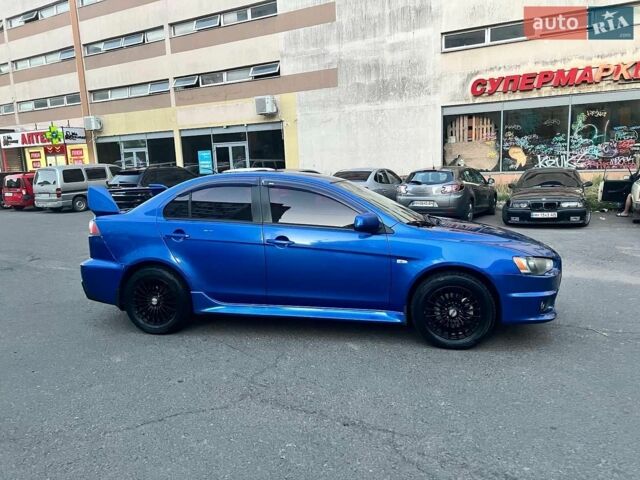 Синій Міцубісі Lancer, об'ємом двигуна 2 л та пробігом 197 тис. км за 5800 $, фото 1 на Automoto.ua