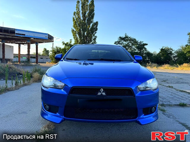 Синий Мицубиси Лансер, объемом двигателя 2 л и пробегом 240 тыс. км за 7700 $, фото 1 на Automoto.ua